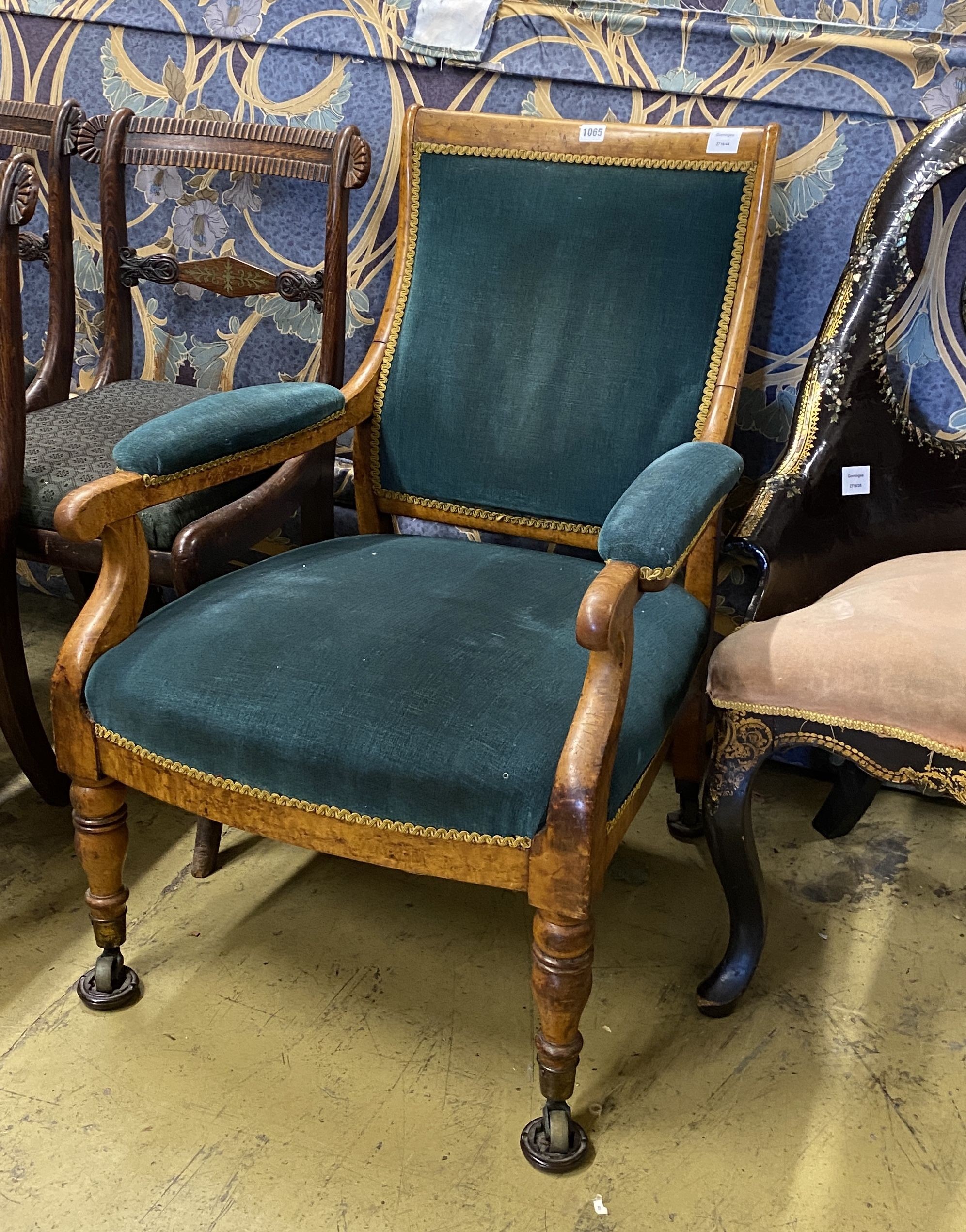 A Victorian maple upholstered open armchair, width 62cm, depth 60cm, height 85cm